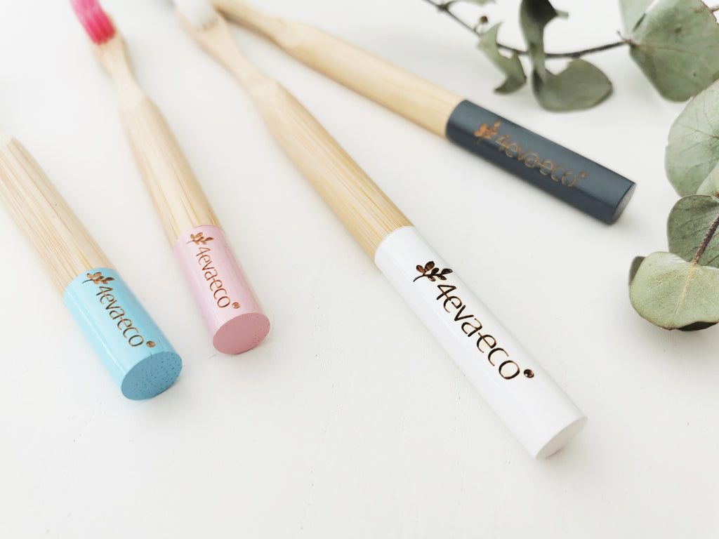 Bamboo toothbrushes handles charcoal, white, pink and blue