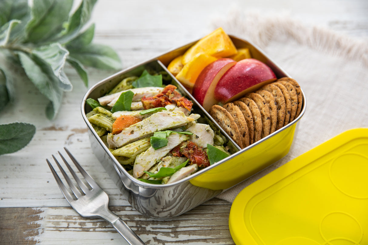 Pasta, crackers and fruits in 2 section lunch box