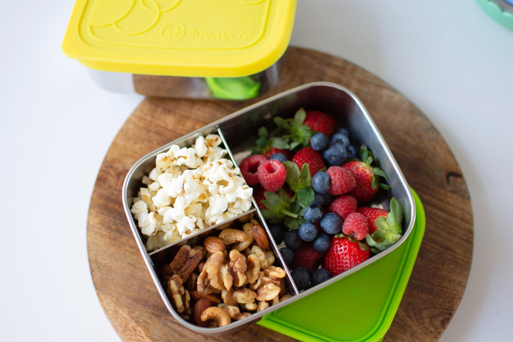 Mix berries, popcorns and mix nuts in 3 section lunch box