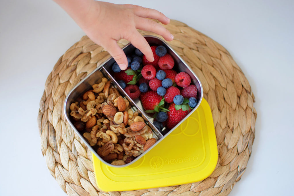 Mix nuts and berries in 2 section stainless steel lunch box