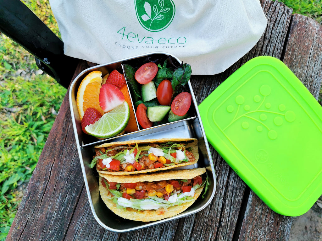 tacos, salad and fruits in 3 section lunch box 